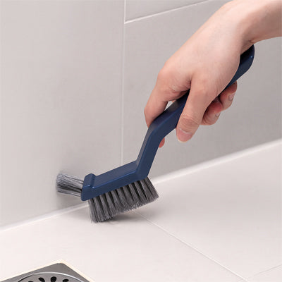 brosse de nettoyage bleu mur coins jointure