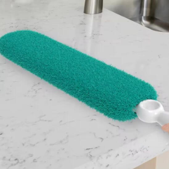 vert plumeau pour poussiere pose table